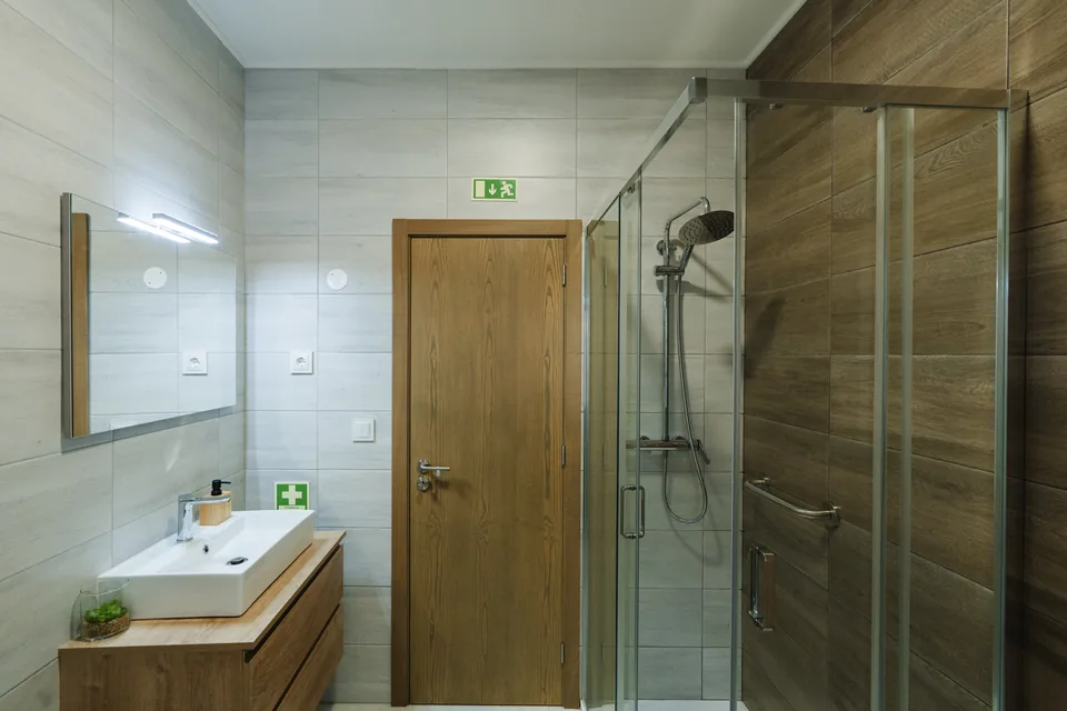 Main-house bathroom vanity and glass shower