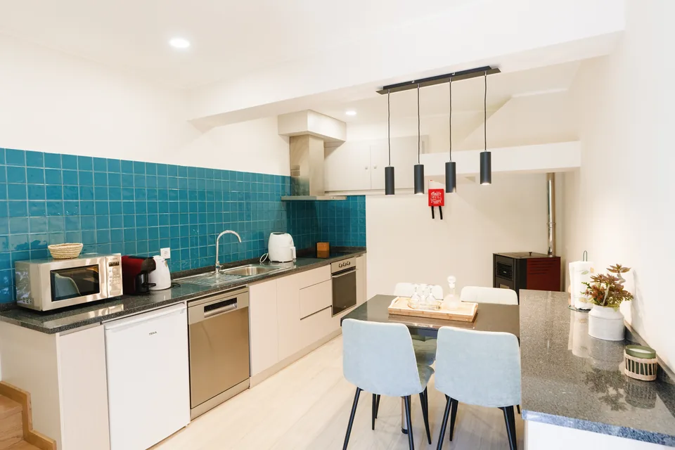 Kitchen and dining counter, blue tiled backsplash