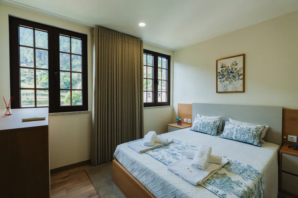 Bedroom 1 double bed and windows, patterned bedding