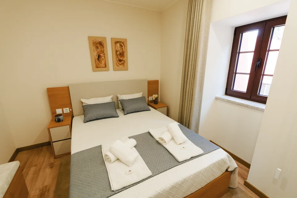 Bedroom 2 double bed beside window