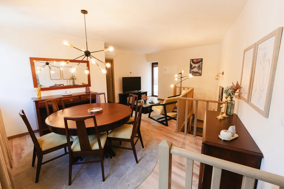 Dining table, piano and seating in the main house