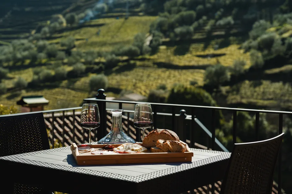 Regional board on terrace table with vineyards in background